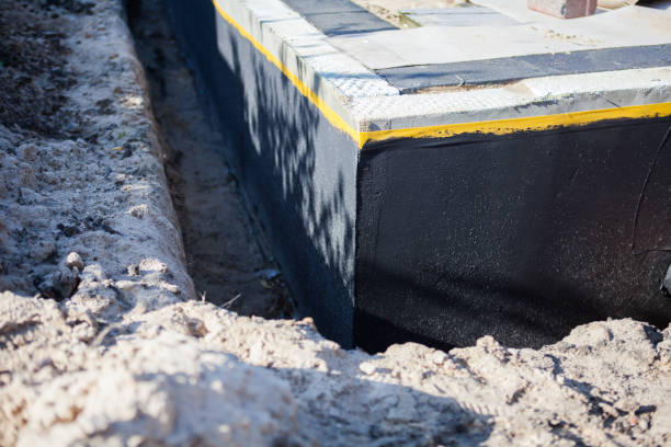 Professional Waterproofing technician working in Bloomfield, IN